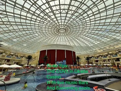 a large building with a domed ceiling and a swimming pool at Luxurious Modern Penthouse 2BR Cross City of Dreams OKADA SOLAIRE MOA Airports in Manila
