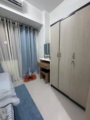 a bathroom with a vanity and a sink in a room at Minamalist modern Condo with Chic touches 