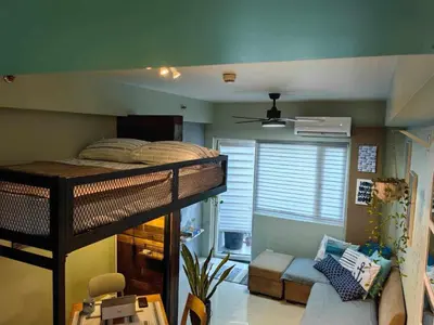 a bedroom with a bunk bed in a room at Condo Unit at SMDC Breeze Residences with a view in Manila