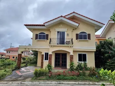 a house with a balcony on a street at Verona Subdivision in Matangtubig