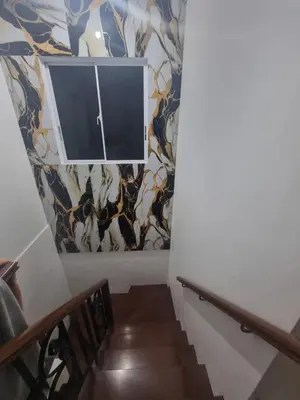 a stairway with a window and a wall at Verona Subdivision in Matangtubig