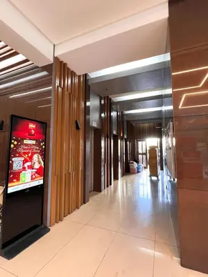 a hallway with a television in a building at Sunset Studio in Manila