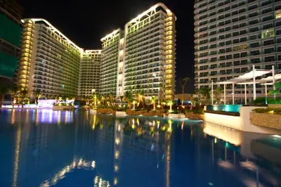 a large pool of water in front of tall buildings at Azure Urban Resort Parañaque in Manila