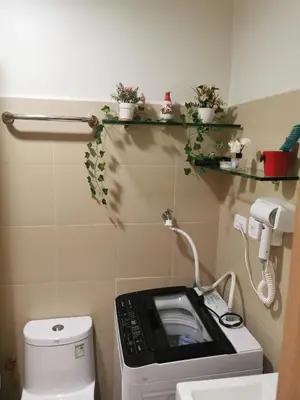 a small bathroom with a toilet and a microwave at aldo shore 3 residence mall of asia in Manila