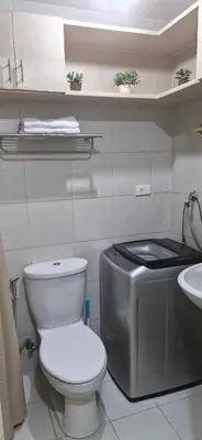 a bathroom with a toilet and a sink at Urban Escape- SM Jazz Residences in Manila
