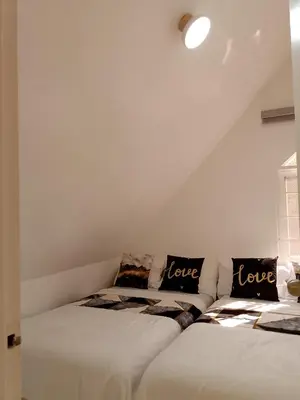 two beds sitting next to each other in a room at Montalban Villa in General Trias