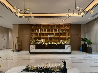 a lobby with a christmas display in the middle at New 1BR Condo Near Venice Canal & BGC with Balcony - 7e in Manila