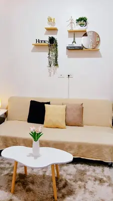 a living room with a couch and a table at Shore Residences Moa Area Pasay City in Manila