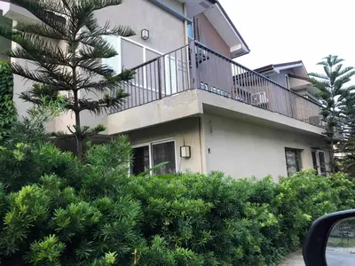 a building with a balcony on the side of it at Our home is your castle in Caong