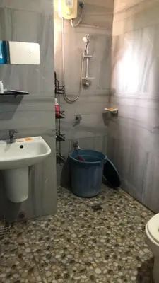 a bathroom with a sink and a tub next to a toilet at Our home is your castle in Caong