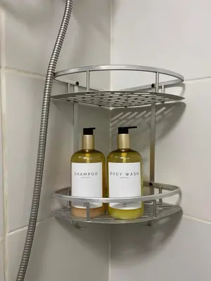 two bottles of soap on a shelf in a bathroom at Staycation in Mandaluyong in Manila