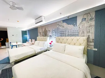 three beds in a room with a mural on the wall at Luxury Penthouse across City of Dreams II 7pax in Manila