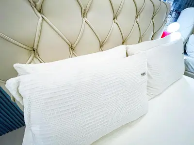 a bed with two white pillows on it at Luxury Penthouse across City of Dreams II 7pax in Manila