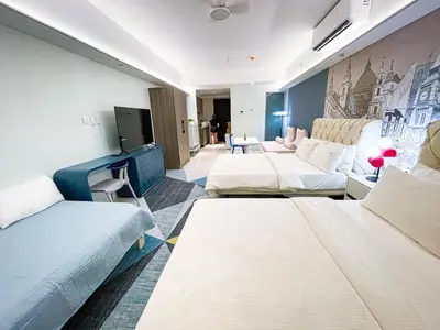 a hotel room with two beds and a couch at Luxury Penthouse near Solaire, City of Dreams in Manila
