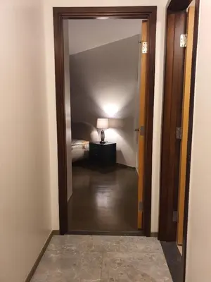 a hallway with a door leading to a bedroom at The Imperium Luxury Condominium in Manila