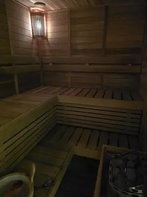 a small sauna with two bunk beds and a light at The Imperium Luxury Condominium in Manila