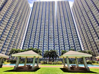 a large building with two gazebos in front of it at 1Br Fully Furnished Condo Unit at Light Residences in Manila