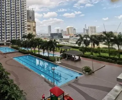 a view of a swimming pool in a city at 1Br Fully Furnished Condo Unit at Light Residences in Manila