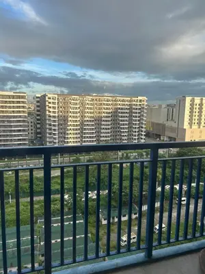 a view of the city from a balcony at Chay place sea residence in Manila