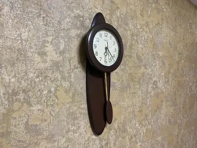 a clock is hanging on a wall at Air Residence Luxury condo in Manila