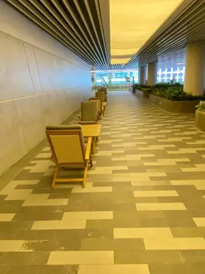 a row of chairs in a hallway in a building at Air Residence Luxury condo in Manila