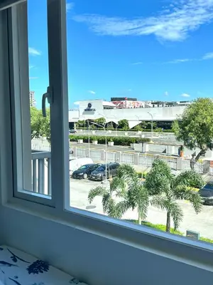 a window with a view of a parking lot at South Residences Tower in Manila