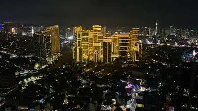 a view of a city at night with lights at Maleel Rentals in Manila