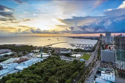 an aerial view of a city with a river and buildings at SMDC Breeze Residences in Manila