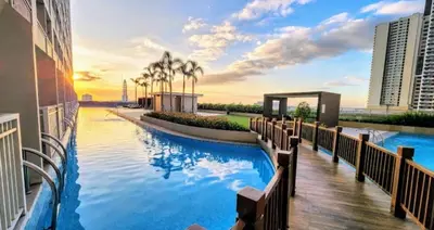 a swimming pool on the side of a building at SMDC Breeze Residences in Manila