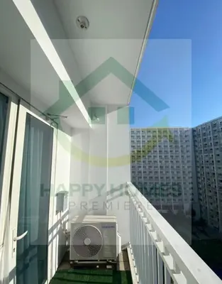 a balcony of a building with a air conditioner at Stunning Hotel Feels at Shore in Manila