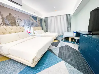 a hotel room with a bed and a tv at Lovely Penthouse near Airport, City of Dreams 8pax in Manila