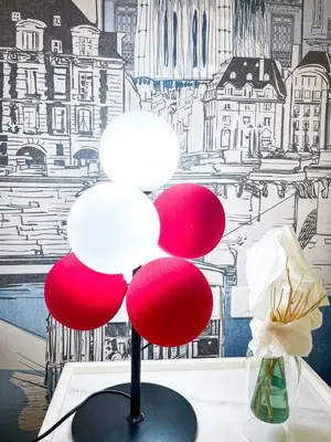 a red and white lamp sitting on top of a table at Lovely Penthouse near Airport, City of Dreams 8pax in Manila