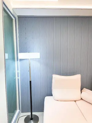 a bedroom with a white bed and a lamp at Lovely Penthouse near Airport, City of Dreams 8pax in Manila