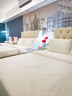 three beds in a room with a mural on the wall at Lovely Penthouse near Airport, City of Dreams 8pax in Manila