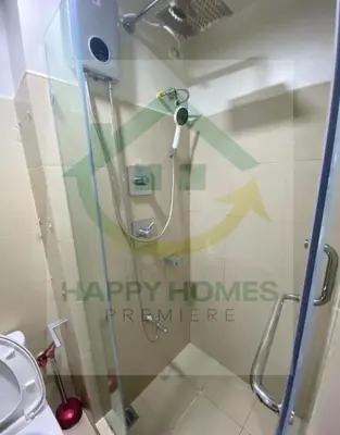 a shower stall in a bathroom with a toilet at Serene Suite at Shore 3 in Manila