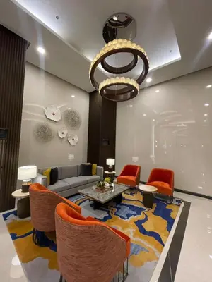 a living room with a couch and a table and chairs at Modern 2BR beside Okada Manila with Sunset View in Manila