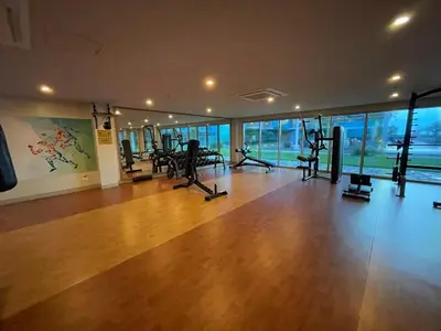 a gym with treadmills and exercise equipment in a building at Luxurious 1BR in Bayshore w Sunset View near Okada in Manila