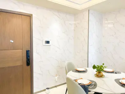 a white dining room with a table and chairs at Modern Luxury 5BR Sunset View beside Okada Manila in Manila