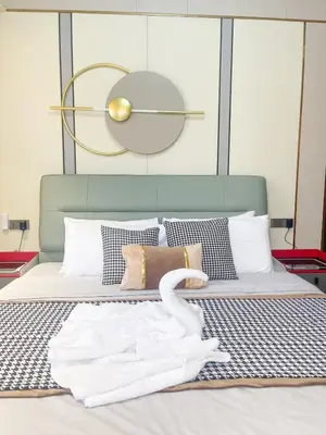 a swan sitting on a bed with a towel on it at Modern Luxury 5BR Sunset View beside Okada Manila in Manila