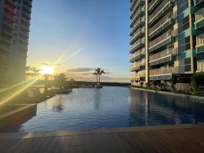 a view of a river between two tall buildings at Luxurious 3BR in Manila Bay across Okada II 12pax in Manila