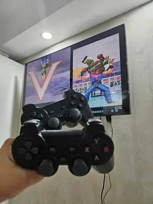 a person holding a video game controller in front of a tv at One Bedroom at Azure Urban Near Airport in Manila