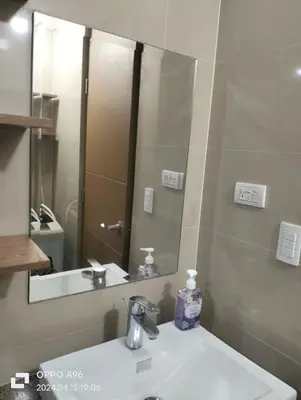 a bathroom with a sink and a mirror at Two Palm Tree Villas by Nadz6 in Manila