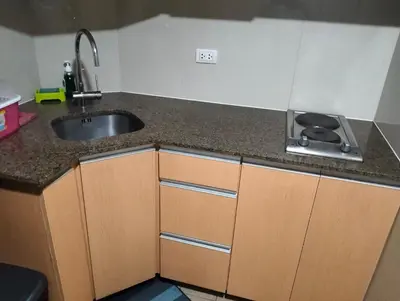a kitchen with a sink and a counter top at Two Palm Tree Villas by Nadz6 in Manila