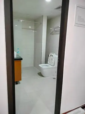 a bathroom with a toilet and a sink at Manila Airport Accommodation at NAIA road in Manila