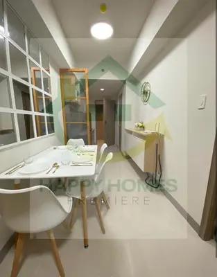 a dining room with a table and chairs at Happy Sunshine at S Residences in Manila