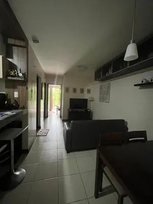 a living room with a couch and a table at Arista Place Condo 2 bedroom unit in Manila