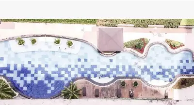 an artist rendering of a swimming pool in a resort at Makati Condo Near Airport & Greenbelt in Manila
