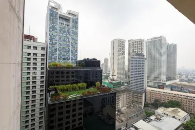 a view of a city skyline with tall buildings at Charming Studio in Greenbelt Makati - Near Malls! in Manila
