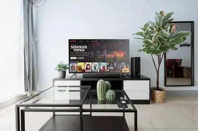 a living room with a tv and a glass table at Free Parking! Beautiful 2BR Home in Central Makati in Manila