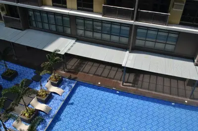 an overhead view of a swimming pool in a building at Gentry Manor Manila Bay Okada Complex MOA&Airport WiFi Netflix 8K in Manila